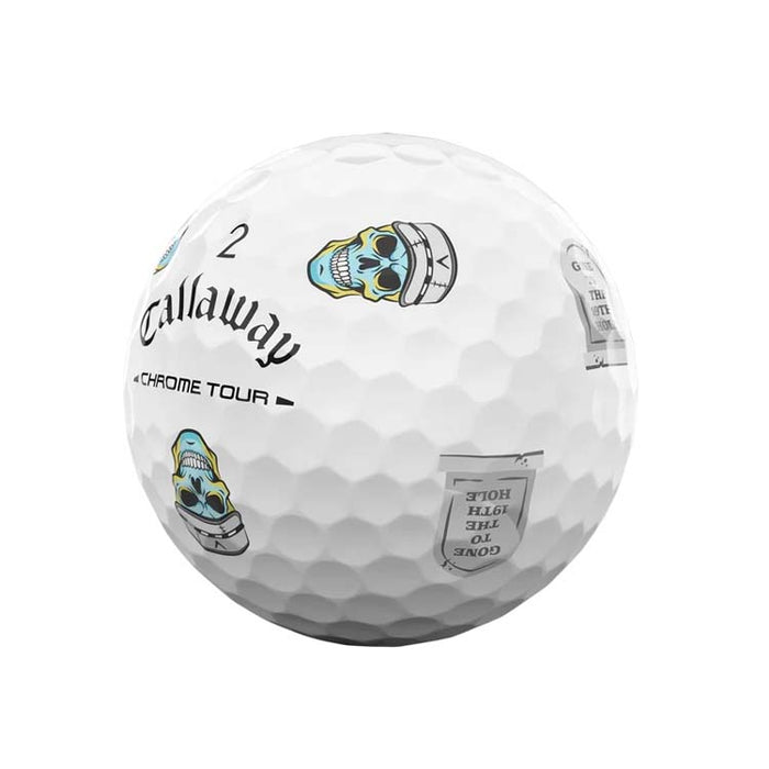 A white Callaway Chrome Tour golf ball with printed graphics, including a skull logo and text, shown on a plain white background.