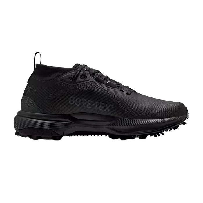 A black GORE-TEX golf shoe with a textured synthetic upper, black laces, and a rugged black sole with spike tips, shown in a side profile on a white background.