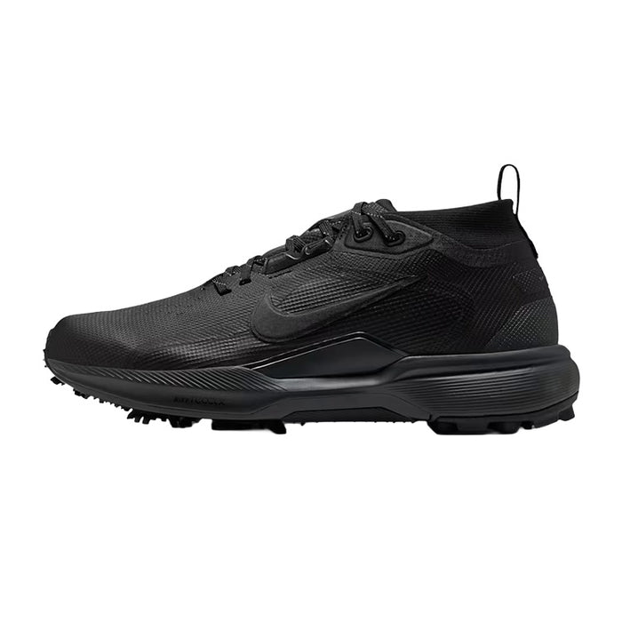 A black Nike golf shoe with a textured mesh upper, black laces, and a thick black sole with golf club tips, shown in a side profile on a white background.
