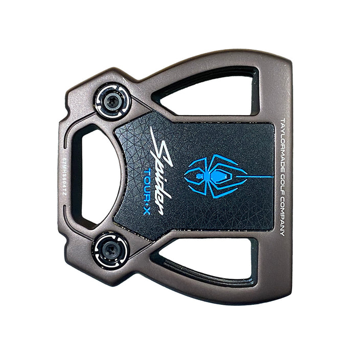 A TaylorMade Tour x golf putter head on a solid white background, featuring a dark metallic gray finish with a textured black center insert highlighted by a blue logo and white 'Spider Tour x' branding.
